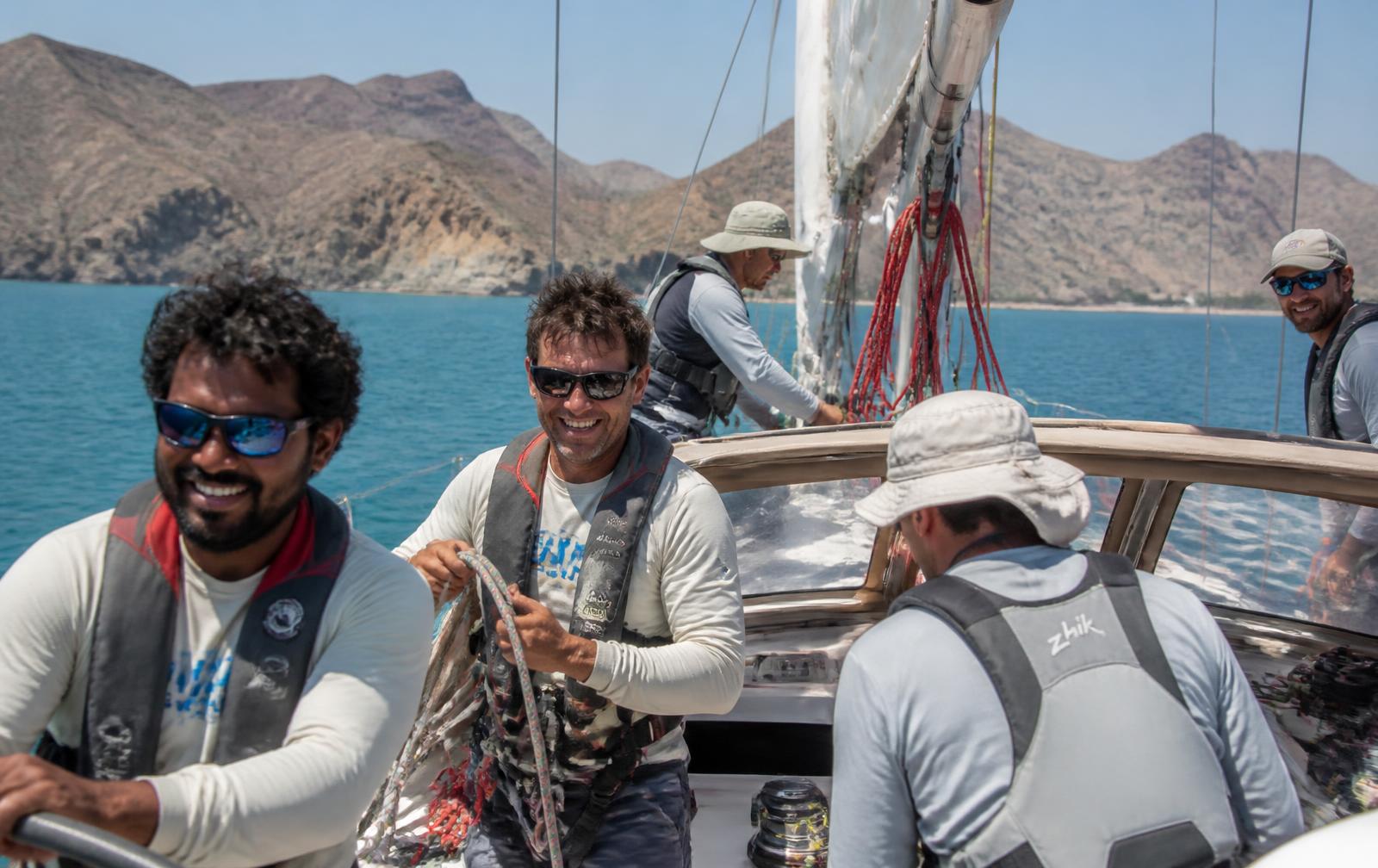 Crew arriving by yacht at an Omani marina